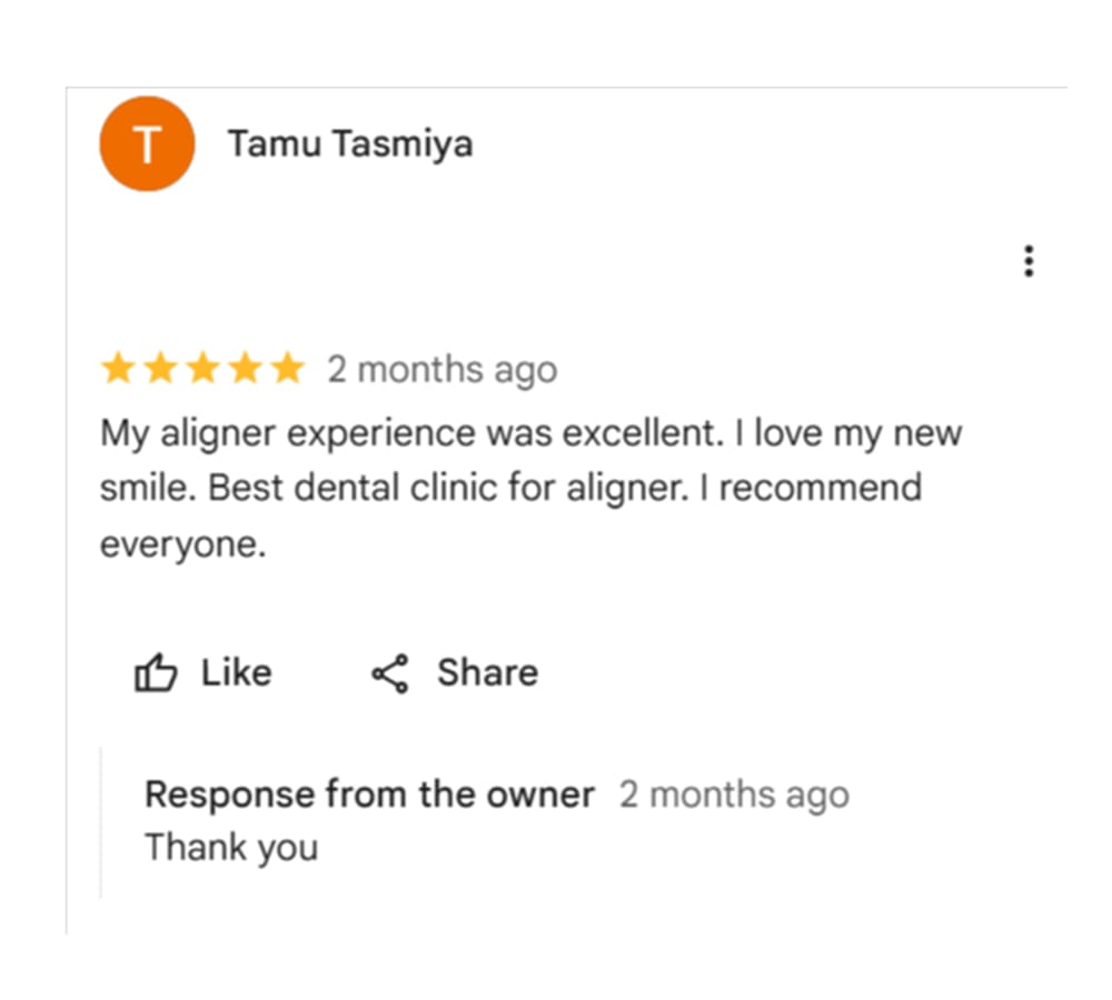 Patient review expressing satisfaction with a new dental smile.